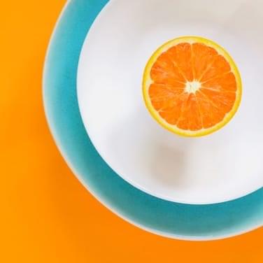 a slice of orange on a plate